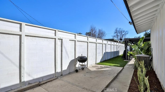 view of patio / terrace featuring area for grilling and central AC unit