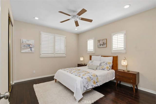 bedroom with ceiling fan and dark hardwood / wood-style flooring