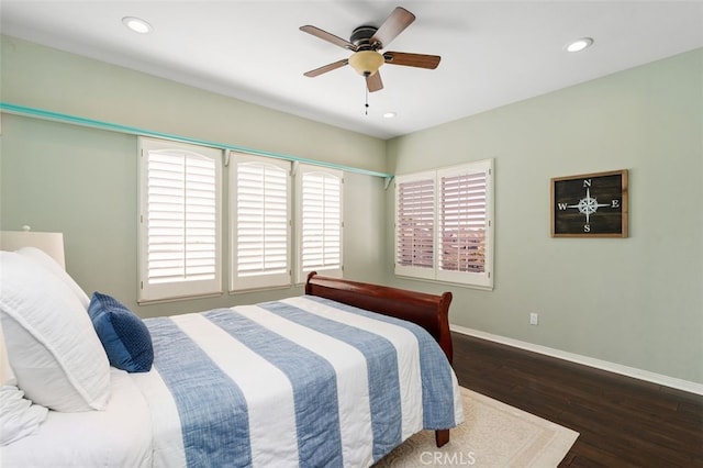 bedroom featuring dark hardwood / wood-style flooring and ceiling fan