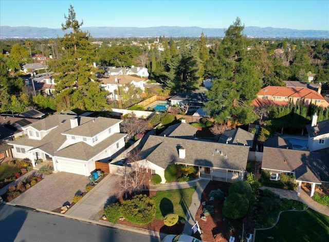 birds eye view of property with a mountain view