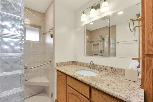 bathroom with vanity and walk in shower