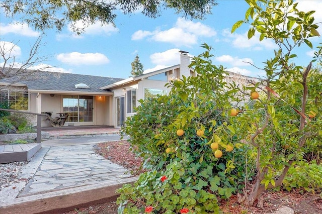 rear view of property featuring a patio