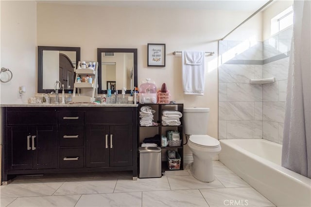 full bathroom with double vanity,  shower combination, a sink, and toilet