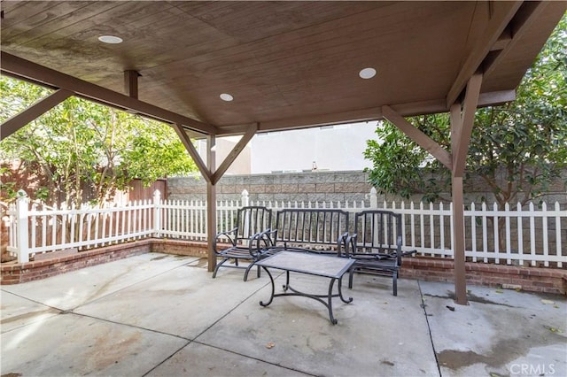 view of patio featuring fence