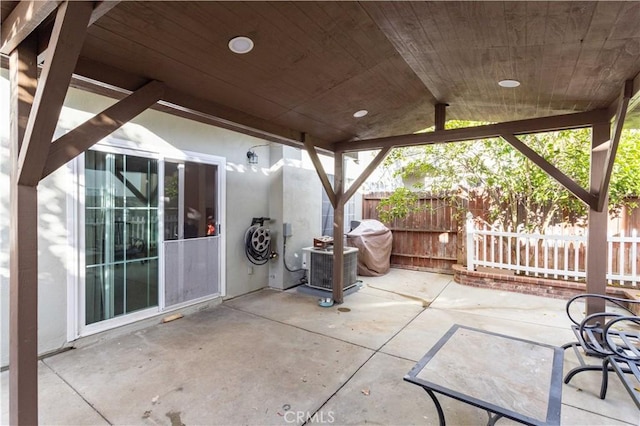 view of patio / terrace with fence and central air condition unit