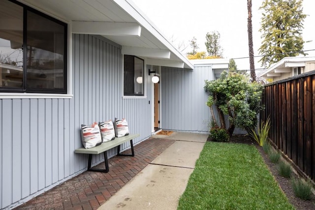 property entrance with a yard