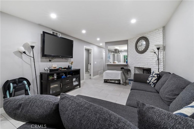 tiled living room with a fireplace