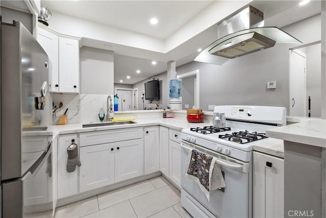 kitchen featuring sink, white range with gas cooktop, white cabinetry, and island exhaust hood