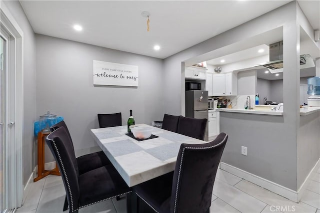 dining space featuring sink