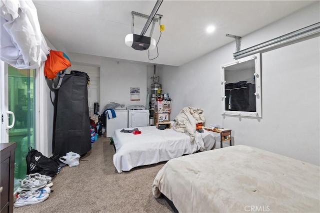 carpeted bedroom with washer and dryer and strapped water heater