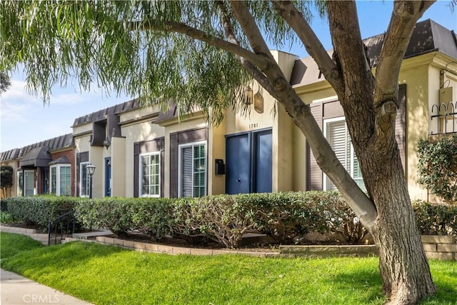 view of property exterior featuring a lawn