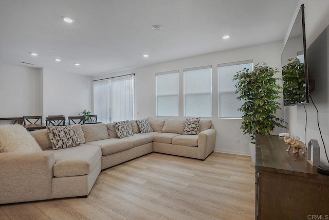 living room with light hardwood / wood-style floors