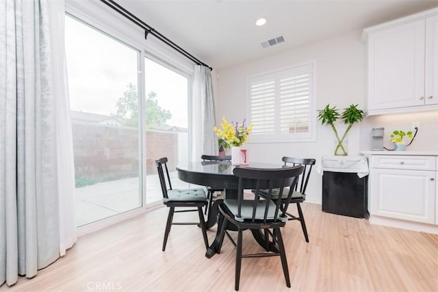 dining room with light wood-type flooring