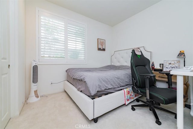 bedroom with light colored carpet