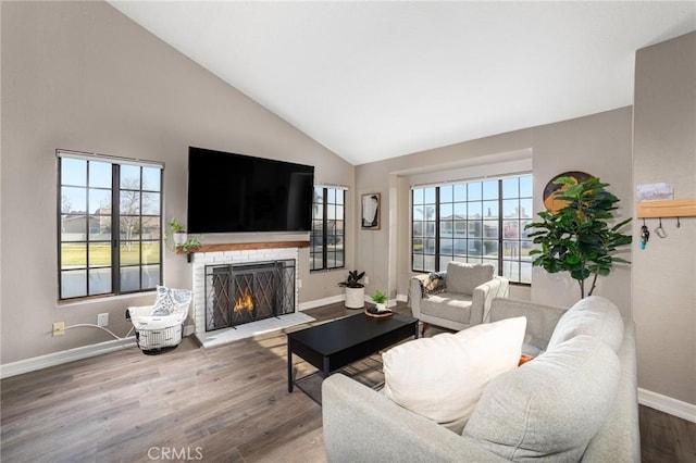 living room with high vaulted ceiling and hardwood / wood-style floors