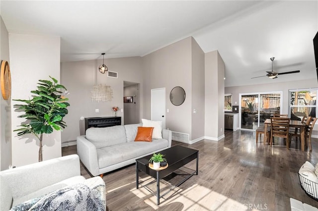 living room featuring hardwood / wood-style flooring, ceiling fan, and lofted ceiling