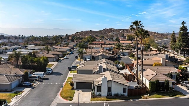 birds eye view of property with a mountain view