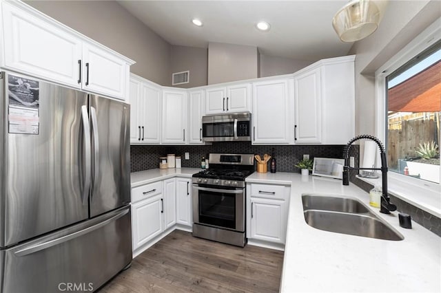 kitchen with white cabinetry, sink, and appliances with stainless steel finishes