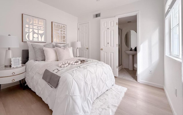 bedroom with light hardwood / wood-style floors