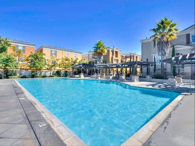 view of pool featuring a pergola and a patio area