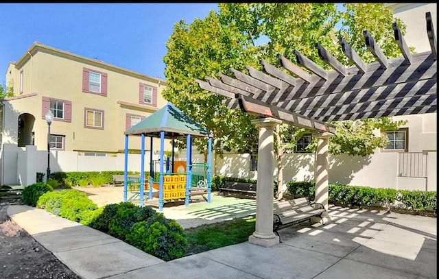 view of jungle gym with a pergola