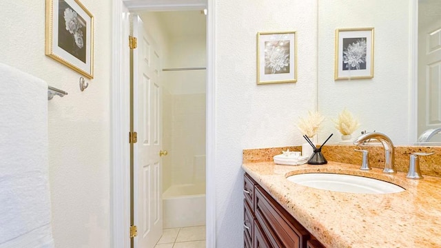 bathroom with tile patterned floors and vanity