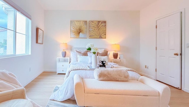 bedroom with light hardwood / wood-style flooring