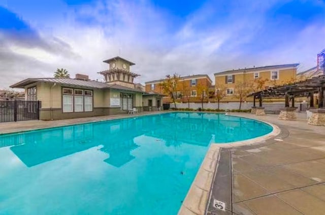 view of pool with a pergola and a patio area