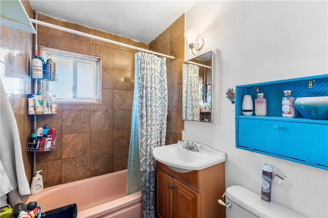 full bathroom with vanity, toilet, and shower / bath combo with shower curtain