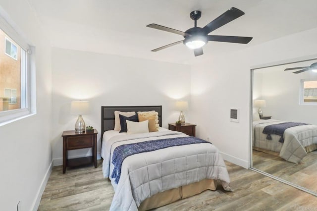 bedroom featuring wood-type flooring and ceiling fan