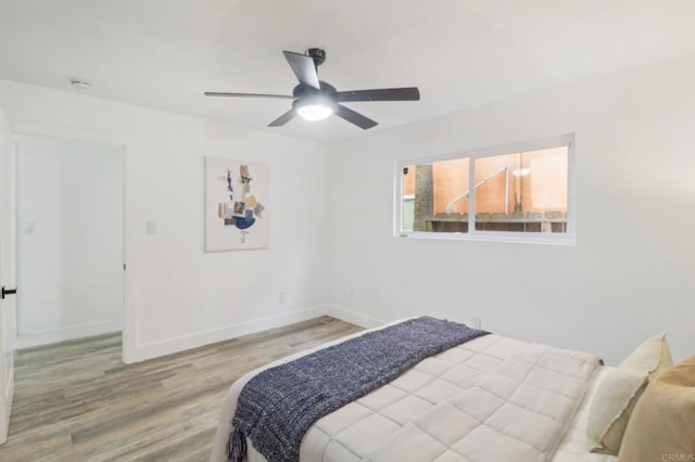 bedroom featuring ceiling fan and light wood-type flooring