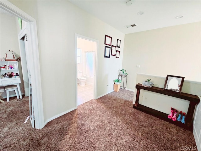 corridor featuring carpet flooring