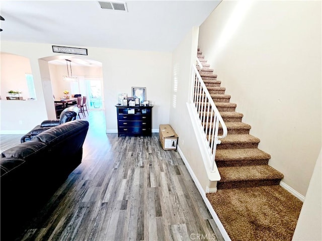 stairs with hardwood / wood-style flooring