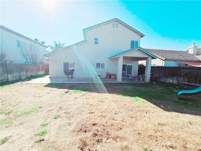 back of house featuring a patio