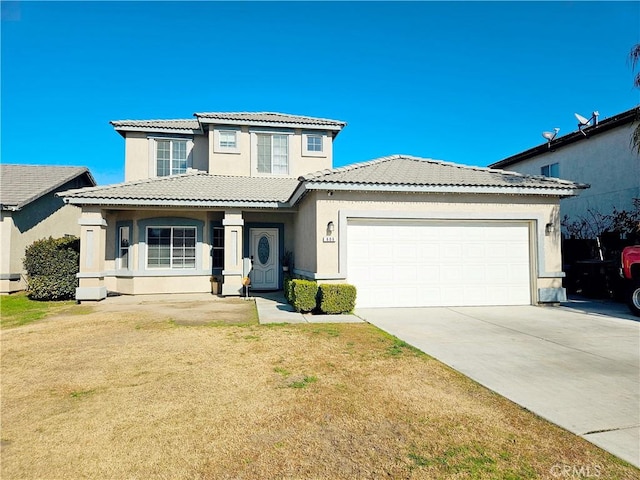 view of front of home with a garage and a front yard