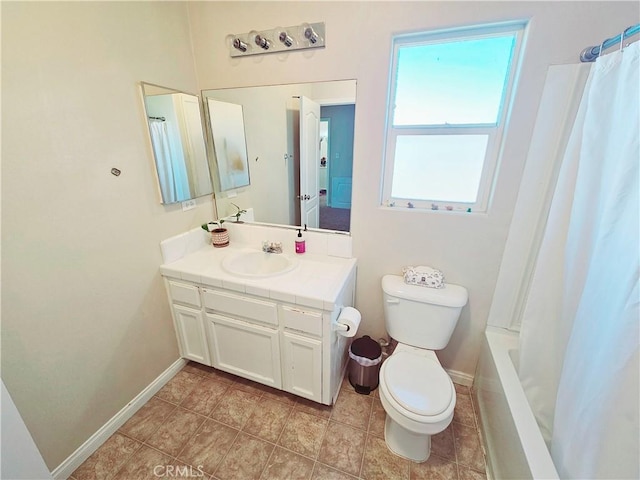 full bathroom with tile patterned floors, vanity, toilet, and shower / bath combo with shower curtain