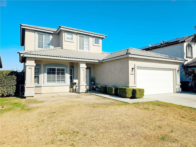 view of front facade with a garage and a front yard