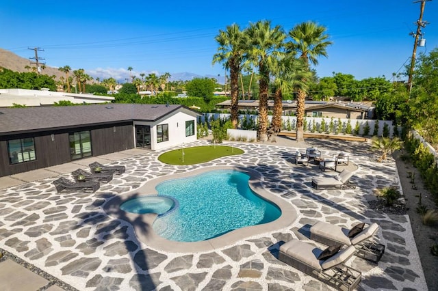 view of swimming pool with a patio area