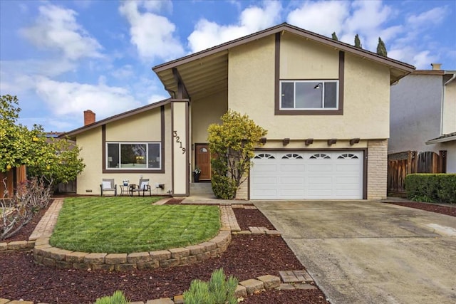 view of front of property with a garage and a front lawn