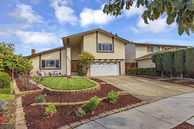 view of front of house featuring a garage and a front yard