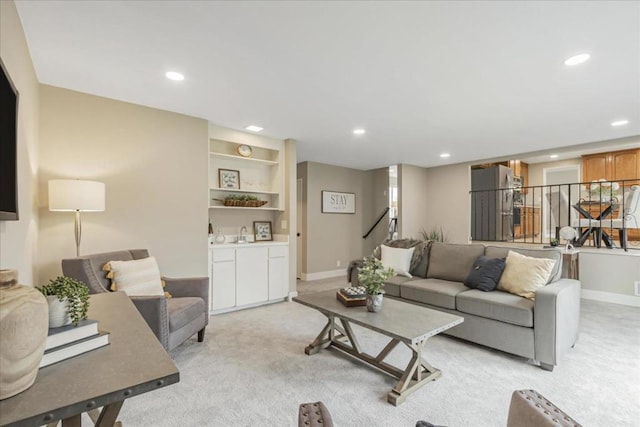 living room featuring light colored carpet and sink