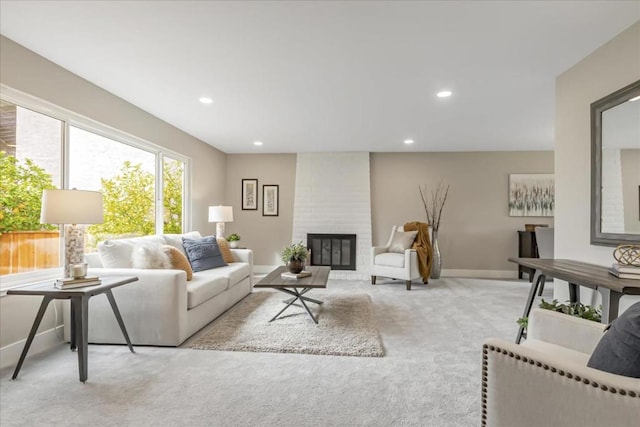 carpeted living room featuring a fireplace