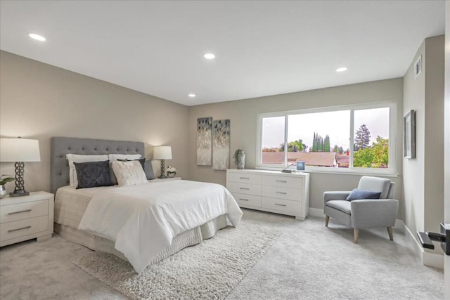 bedroom featuring light carpet