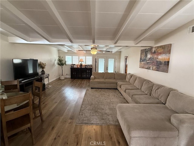 living room with ceiling fan, hardwood / wood-style flooring, french doors, and beamed ceiling