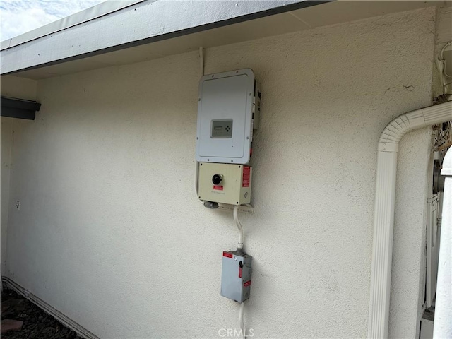 exterior details featuring stucco siding