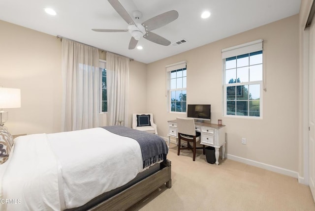 bedroom with light colored carpet and ceiling fan