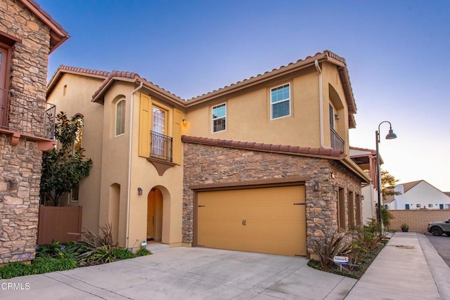 mediterranean / spanish house featuring a garage