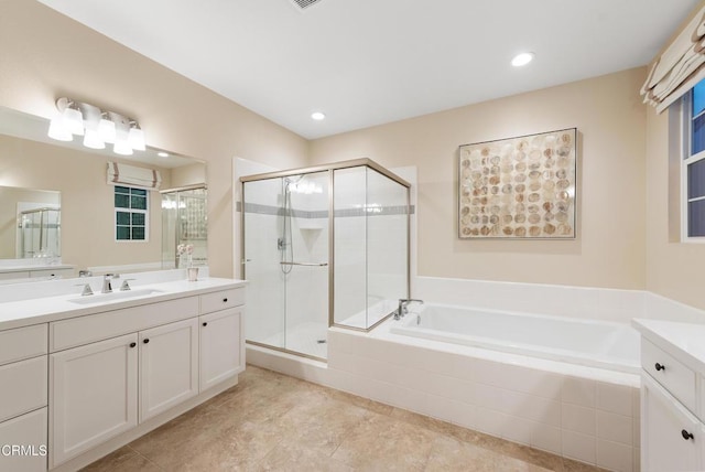 bathroom featuring vanity, separate shower and tub, and tile patterned floors