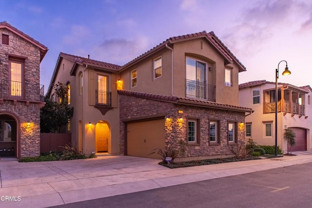 mediterranean / spanish house featuring a garage