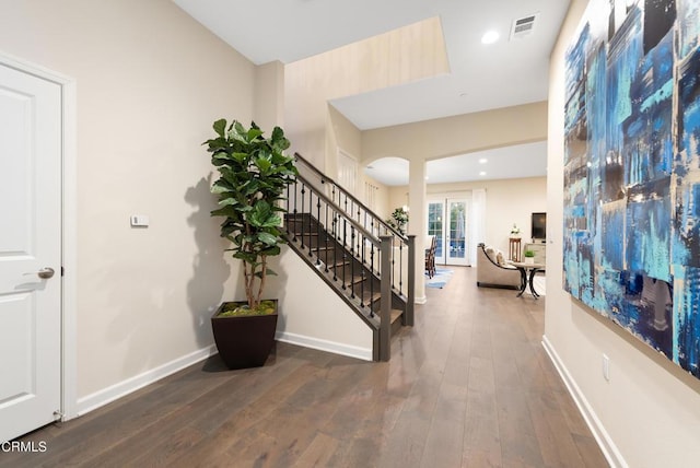 entrance foyer with dark hardwood / wood-style floors